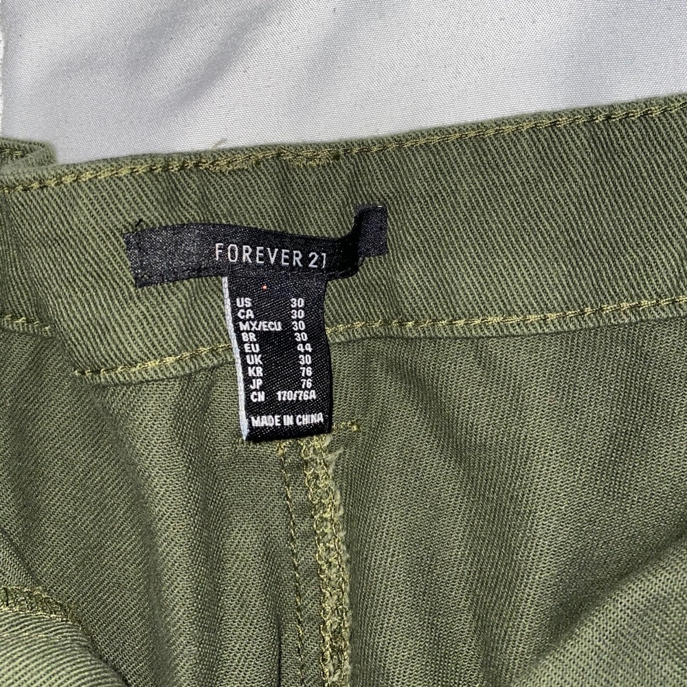 Juniper green mom jeans with pockets and tears